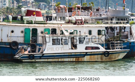 HA LONG CITY, VIETNAM - SEP 23, 2014: Boat at the port of the Halong city where many touristic boat start jorneys over the Halong bay which is UNESCO World heritage