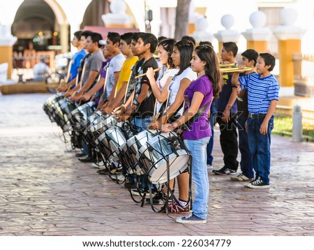MEXICO CITY, MEXICO - DEC 29, 2011: Unidentified Mexican musicians with drums in the street. 60% of Mexican people belong to the Mestizo ethnic group