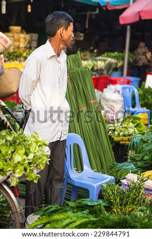 HANOI, VIETNAM - SEP 23. 2014: Unidentified man works at the flower market in Hanoi, Vietnam. Flower market in Hanoi is one of the largest flower markets in Vietnam