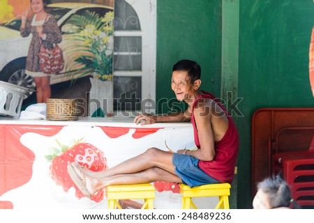 LUANG PRABANG, LAOS - SEP 25, 2014: Unidentified Lao smiling woman. 55% of Laos people belong to the Lao ethnic group
