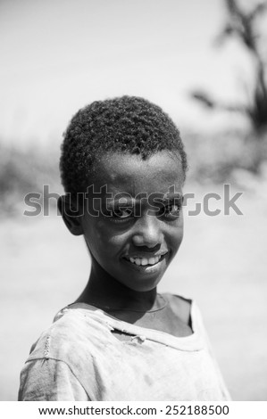 AKSUM, ETHIOPIA - SEPTEMBER 22, 2011: Unidentified Ethiopian boy in the desert. People in Ethiopia suffer of poverty due to the unstable situation