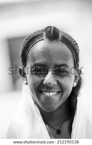 AKSUM, ETHIOPIA - SEP 24, 2011: Unidentified Ethiopian beautiful girl wearing white clothes in Ethiopia, Sep.24, 2011. Children in Ethiopia suffer of poverty due to the unstable situation