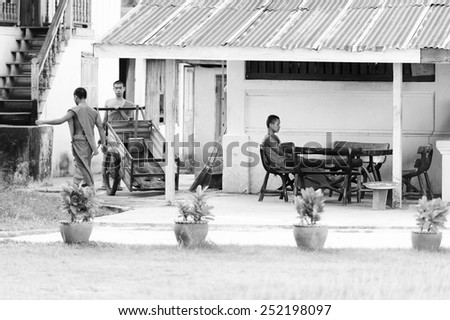 LUANG PRABANG, LAOS - SEP 25, 2014: Unidentified Lao Buddha monks. 55% of Laos people belong to the Lao ethnic group