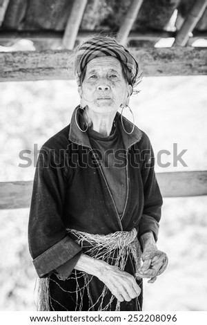 LAO CHAI VILLAGE, VIETNAM - SEP 22, 2014: Unidentified Hmong old woman in traditional clothes in Lao Chai. Hmong is on of the minority eethnic group in Vietnam