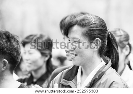 NORTH KOREA - MAY 1, 2012: Korean people are separating into 2 teams for tug of war game during the celebration of the International Worker\'s Day, May 1. May 1 is a national holiday in 80 countries