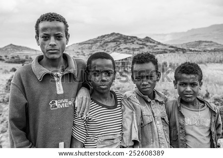OMO, ETHIOPIA - SEPTEMBER 21, 2011: Unidentified Ethiopian young boys. People in Ethiopia suffer of poverty due to the unstable situation