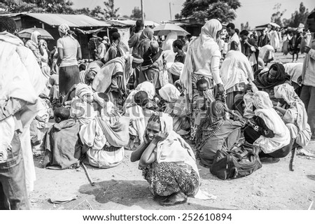 OMO, ETHIOPIA - SEPTEMBER 19, 2011: Unidentified Ethiopian people and children at the local market. People in Ethiopia suffer of poverty due to the unstable situation
