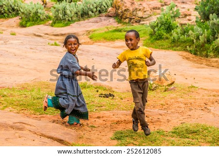 OMO, ETHIOPIA - SEPTEMBER 21, 2011: Unidentified Ethiopian boy and girl in the street. People in Ethiopia suffer of poverty due to the unstable situation