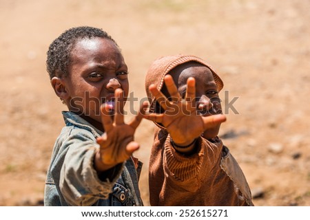 OMO, ETHIOPIA - SEPTEMBER 21, 2011: Unidentified Ethiopian boys in the street. People in Ethiopia suffer of poverty due to the unstable situation