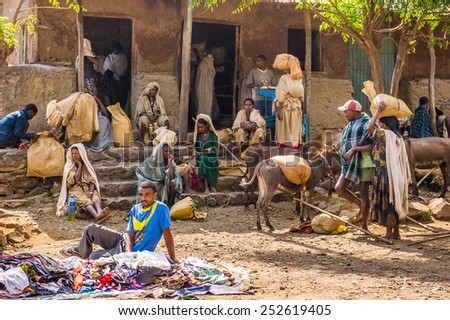OMO, ETHIOPIA - SEPTEMBER 19, 2011: Unidentified Ethiopian people with donkeys at the local market. People in Ethiopia suffer of poverty due to the unstable situation