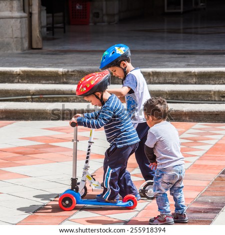 QUITO, ECUADOR - JAN 2, 2015: Unidentified Ecuadorian boy plays in Quito 71,9% of Ecuadorian people belong to the Mestizo ethnic group