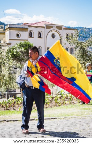QUITO, ECUADOR - JAN 2, 2015: Unidentified Ecuadorian man with Ecuadorian national flag. 71,9% of Ecuadorian people belong to the Mestizo ethnic group