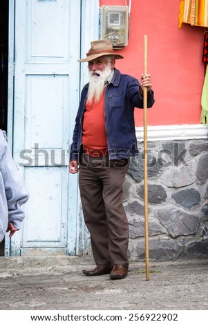 RIOBAMBA, ECUADOR - JAN 7, 2015: Unidentified Ecuadorian  old man with a white beard and a stick. 71,9% of Ecuadorian people belong to the Mestizo ethnic group