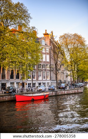 AMSTERDAM, NETHERLANDS - MAY 1, 2015:  Architecture on the Canal of Amsterdam. Amsterdam is the capital city and most populous city of the Kingdom of the Netherlands