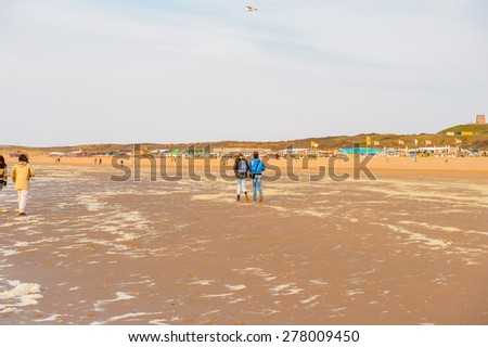THE HAGUE, NETHERLANDS - MAY 2, 2015: Unidentified people of the coast of the North Sea in the Hague, Netherlands. Hague is the capital of the province South Holland