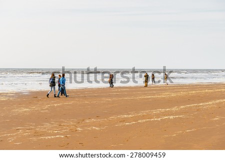 THE HAGUE, NETHERLANDS - MAY 2, 2015: Unidentified people of the coast of the North Sea in the Hague, Netherlands. Hague is the capital of the province South Holland