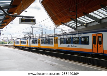 AMSTERDAM, NETHERLANDS - JUN 1, 2015: Train at the Amsterdam Bijlmer ArenA metro station. It\'s a  railway station in the Bijlmermeer neighbourhood of the Amsterdam Zuidoost stadsdeel