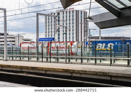 AMSTERDAM, NETHERLANDS - JUN 1, 2015: Train witn BLS logo at Amsterdam Bijlmer ArenA metro station. It\'s a  railway station in the Bijlmermeer neighbourhood of the Amsterdam Zuidoost stadsdeel
