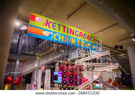 AMSTERDAM, NETHERLANDS - JUN 2, 2015: Children chain reaction construction in the Science Center Nemo, a science center in Amsterdam. The museum has origins in 1923