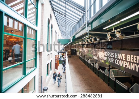 AMSTERDAM, NETHERLANDS - JUN 3, 2015: Stable iHeineken Experience center, a historic brewery for Heineken beer. Gerard Adriaan Heineken was a founder of the Heineken beer