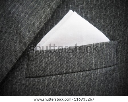 Close-up of black men's suit chest pocket. Vertical version please check  Image ID: 142145656.