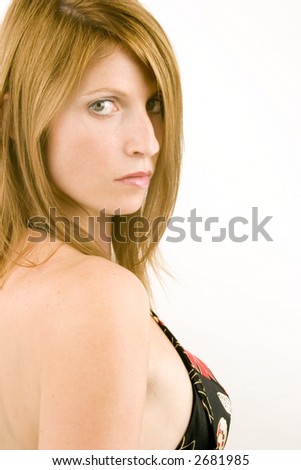 A portrait of a young woman against a plain background.