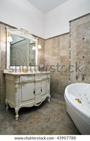Interior of luxury bathroom with beautiful old-styled rustic furniture