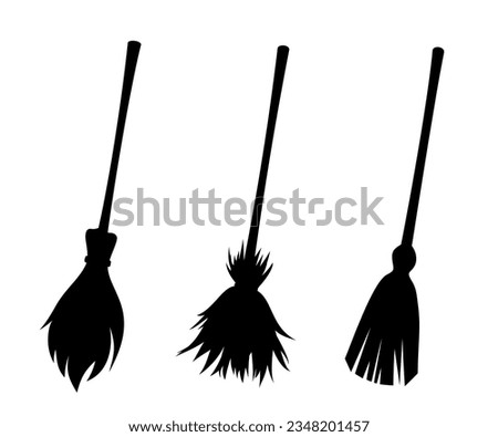 Witches brooms. Set of black silhouettes of brooms isolated on a white background. Vector illustration