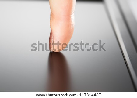 one finger touches the screen touch-pad pc, isolated on white background