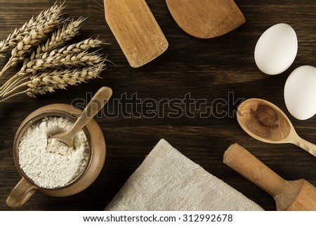 pot of flour, wheat ears, kitchen utensils on wooden background. homemade, menu, recipe, mock up