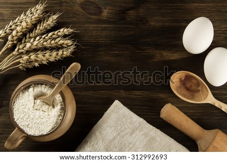 pot of flour, wheat ears, kitchen utensils on wooden background. homemade, menu, recipe, mock up