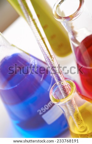 Abstract background of laboratory equipment. Styling and some grain applied to image.