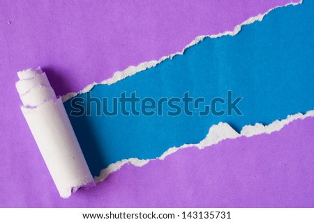 Recycled paper. Purple and blue. Torn apart.