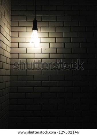 Old white ceramic wall background texture with a dark light from