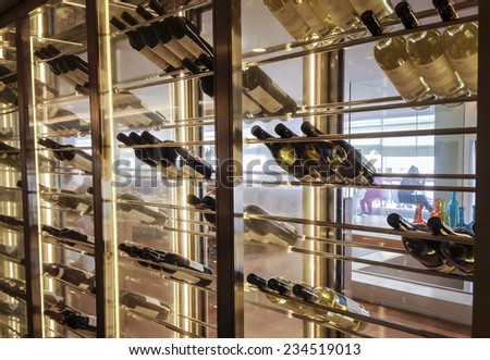 TEL-AVIV -  NOVEMBER 25,2014: Elegant wine storage refrigerator with glass doors and metal wine shelves