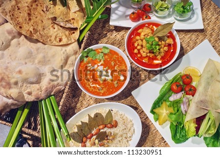 Vegetarian curry with Southern flat bread Curry with rice and a salad with nuts,without meat there are Vegetarian food for health.