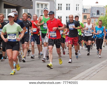 COPENHAGEN - MAY 21: More the 12,000 runners from 40 countries participate in the yearly Copenhagen Marathon. It covers a 42- kilometer route mostly within the city centre in Copenhagen, Denmark on May 21, 2011.