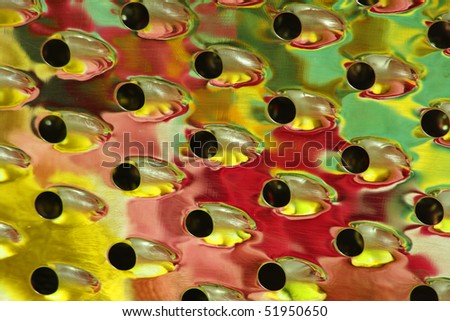 Abstract pattern of color made with a cheese grater