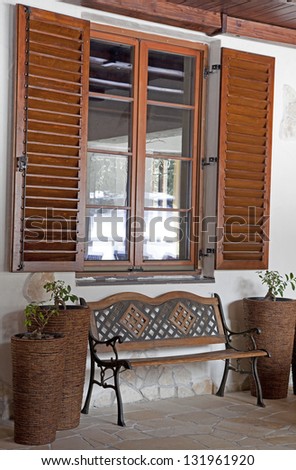 Bench in front of window