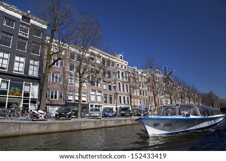 AMSTERDAM, NETHERLANDS - MARCH 26: Amsterdam architecture from boat on March 26, 2013 in Amsterdam
