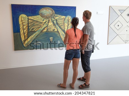 BRATISLAVA, SLOVAKIA - JUN 28: People looking at the picture in the museum of new art Danubiana in city Bratislava on Jun 28, 2014 in Bratislava