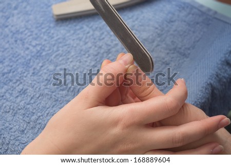 cut nails nail file on hand