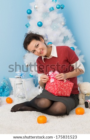 young business woman open christmas gift and smile