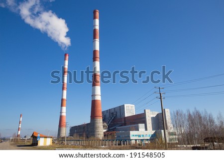 building and two pipes in red and white striped