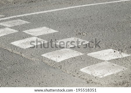 speed bumps on  road in  white square
