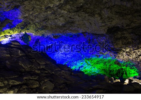 Kungur, Russia - November 25, 2014. Kungur Ice Cave. Blue and green lights in the cave walls Underwater