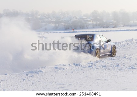 Dobryanka, Russia - February 7, 2015. Urban ice race.  Sport car racing on snow race track in winter