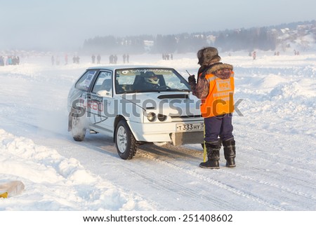 Dobryanka, Russia - February 7, 2015. Urban ice race. White Machine and the referee before the start
