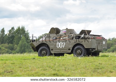 Perm, Russia - August 2, 2015. Military Aviation and sports festival. Soviet armored personnel carrier rides on the field