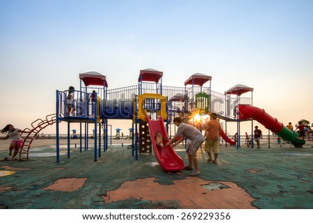 Chonburi, Thailand - 7 April 2015.- Families to take their children to run and play on the playground at Chonburi, Thailand on 7 April 2015.
